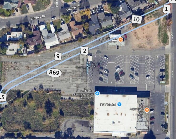 Satellite aerial view of shopping center parking lot